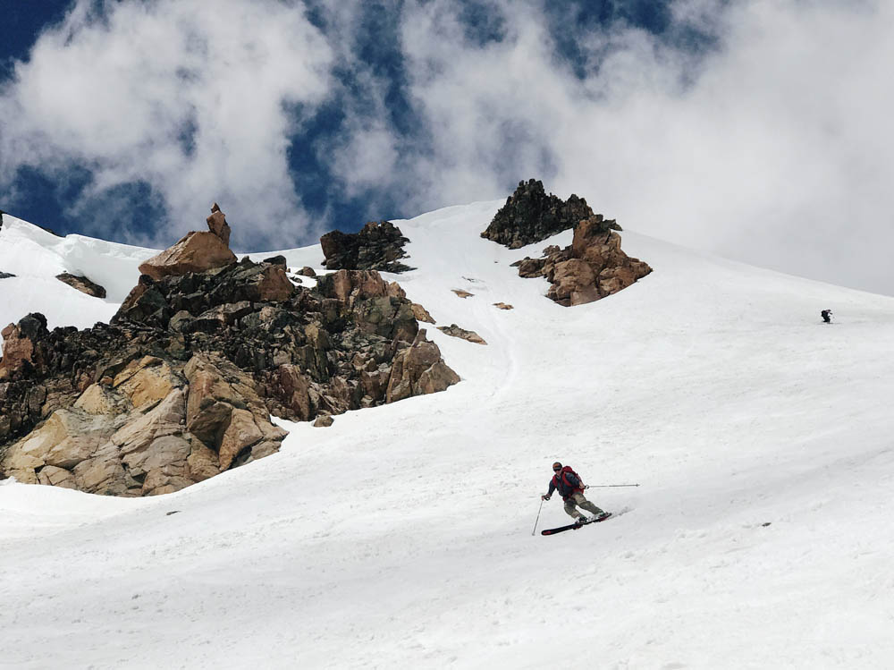 Max skiing Gardner Headwall with Linda skiing in the background