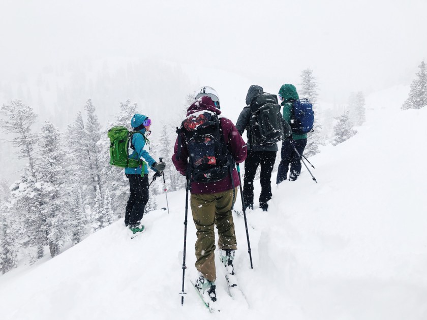 women on skis in deep snow