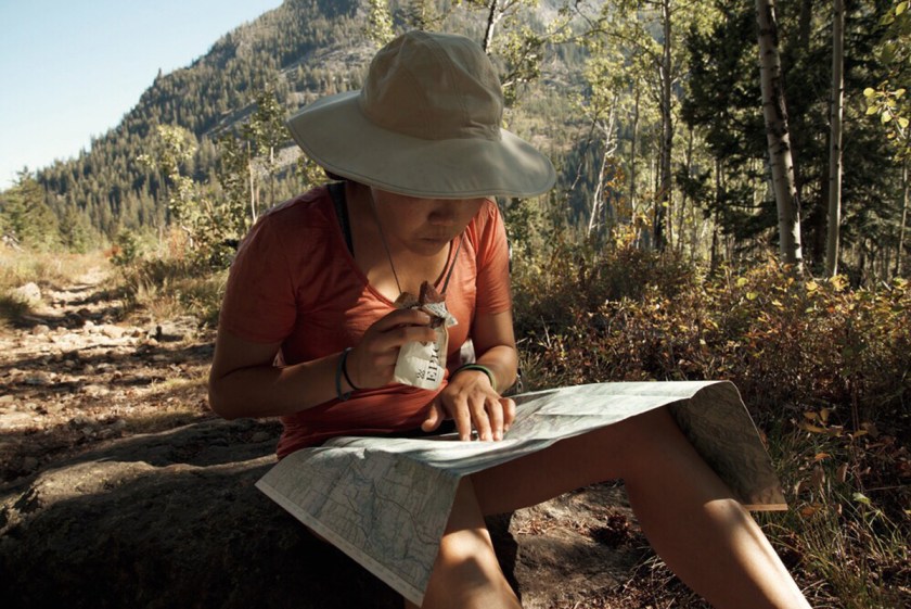 woman reading topo map